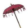 Product image 2 of the product “Bali umbrella, Red with wooden coins and gold leaves hanging around the edge. Approx. 100cm dia. and 250cm height ”